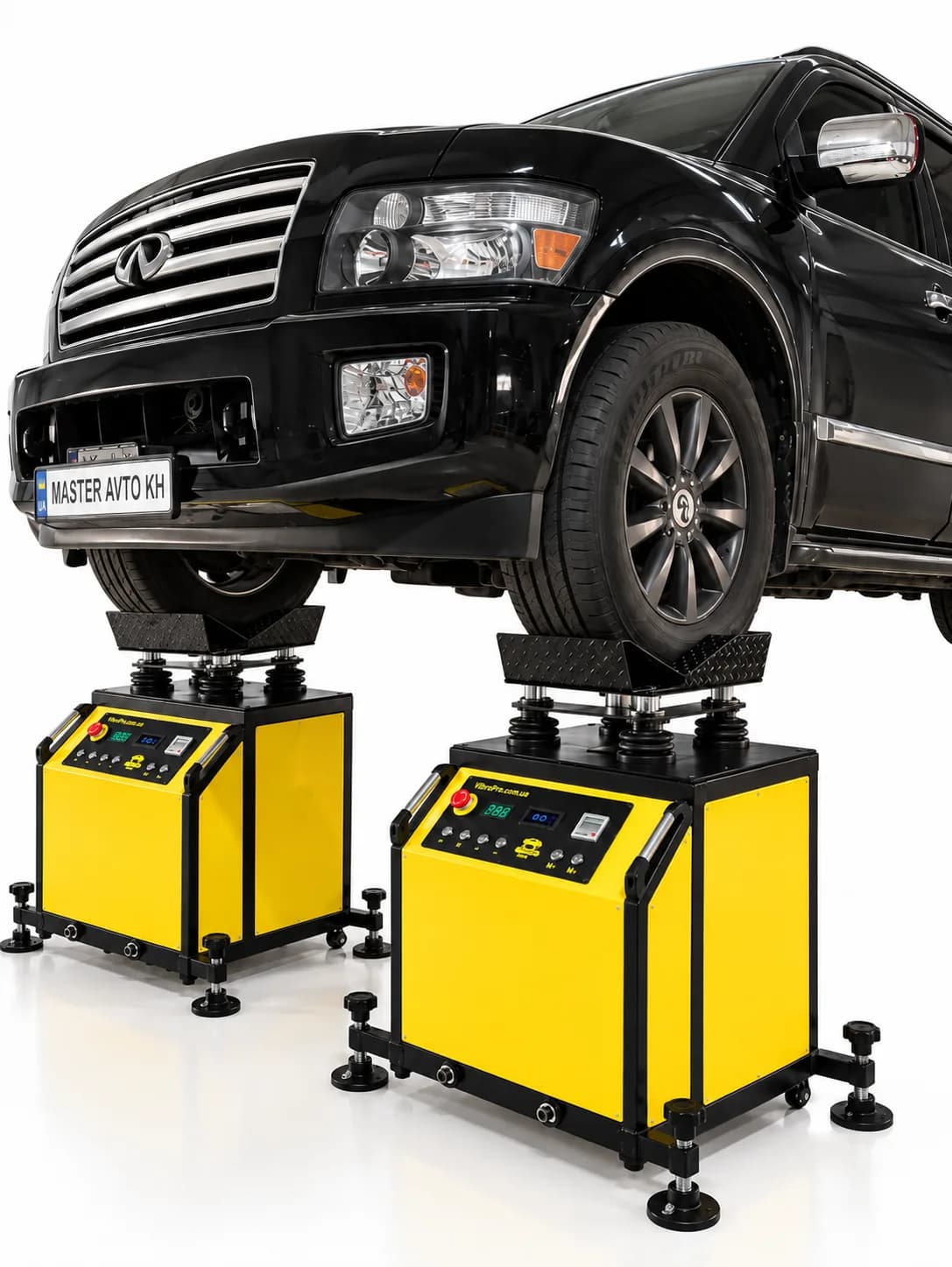 Suspension check on a VibroPro lift-bay stand: vehicle on the active units